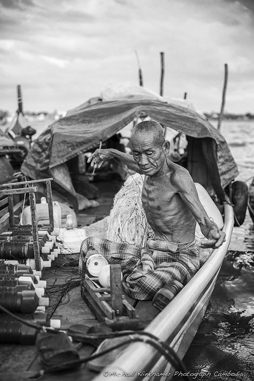 Cham man working cambodia river
