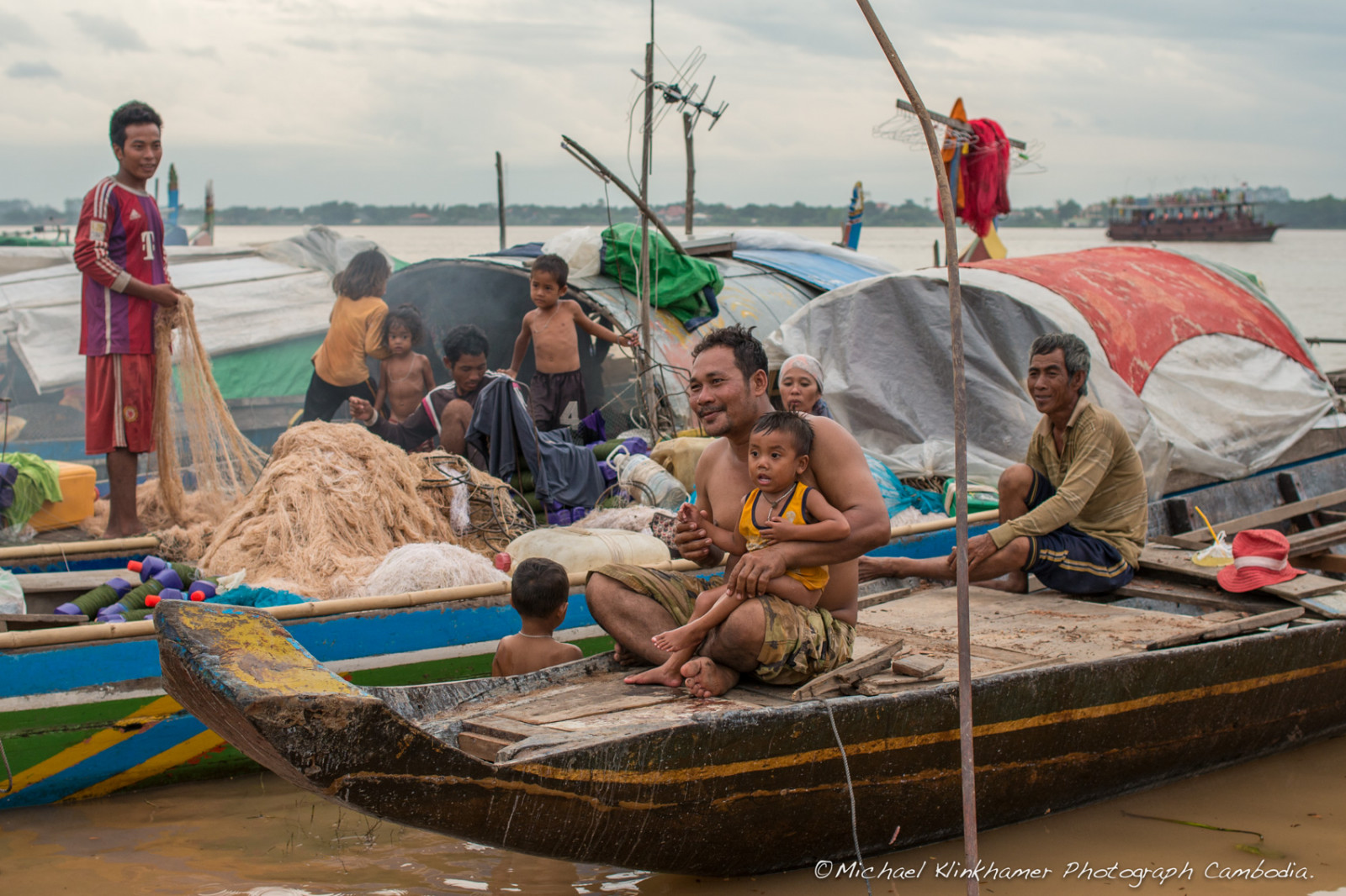 Cham family working on boat Phnom Penh